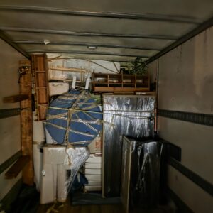 Heavy oak dresser padded and prepared for removal from a tight upstairs nook in Bonnybrook.