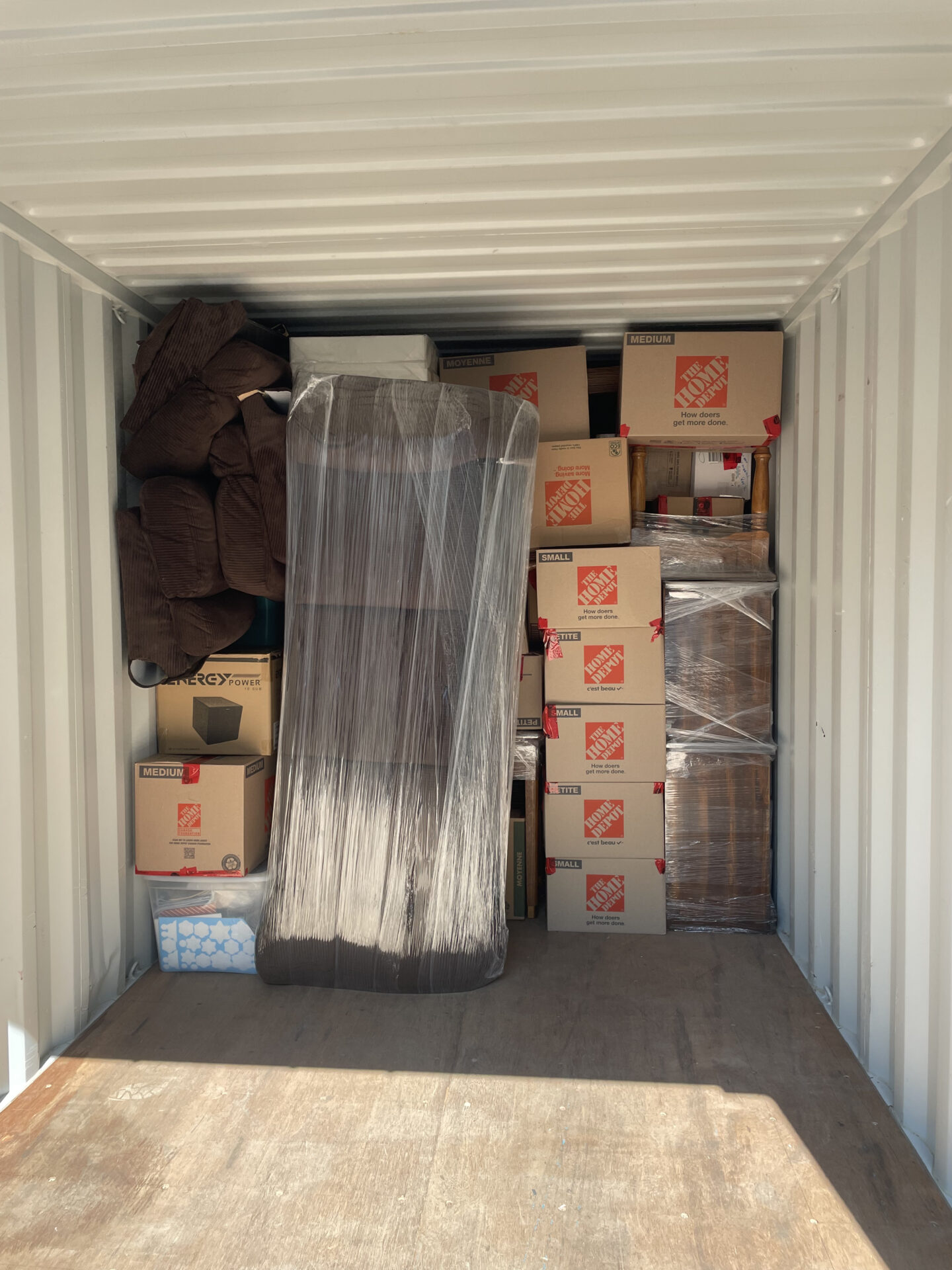 Tall wooden credenza fully wrapped and prepared for a tight archway and hallway turn in Old Toronto.