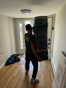 Movers carefully preparing furniture for a home move from East Newton to North Delta in Surrey, ensuring safe transit.