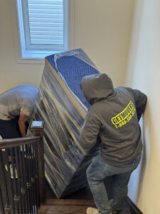 Floor protection used by movers during a residential move in Calgary.