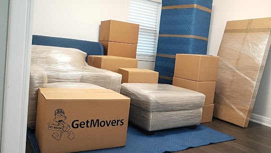 Furniture wrapped and protected for transport during a Halifax apartment move.