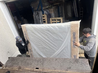 Tall wooden display cabinet and crystal items prepared for an apartment move from Hochelaga to Snowdon.