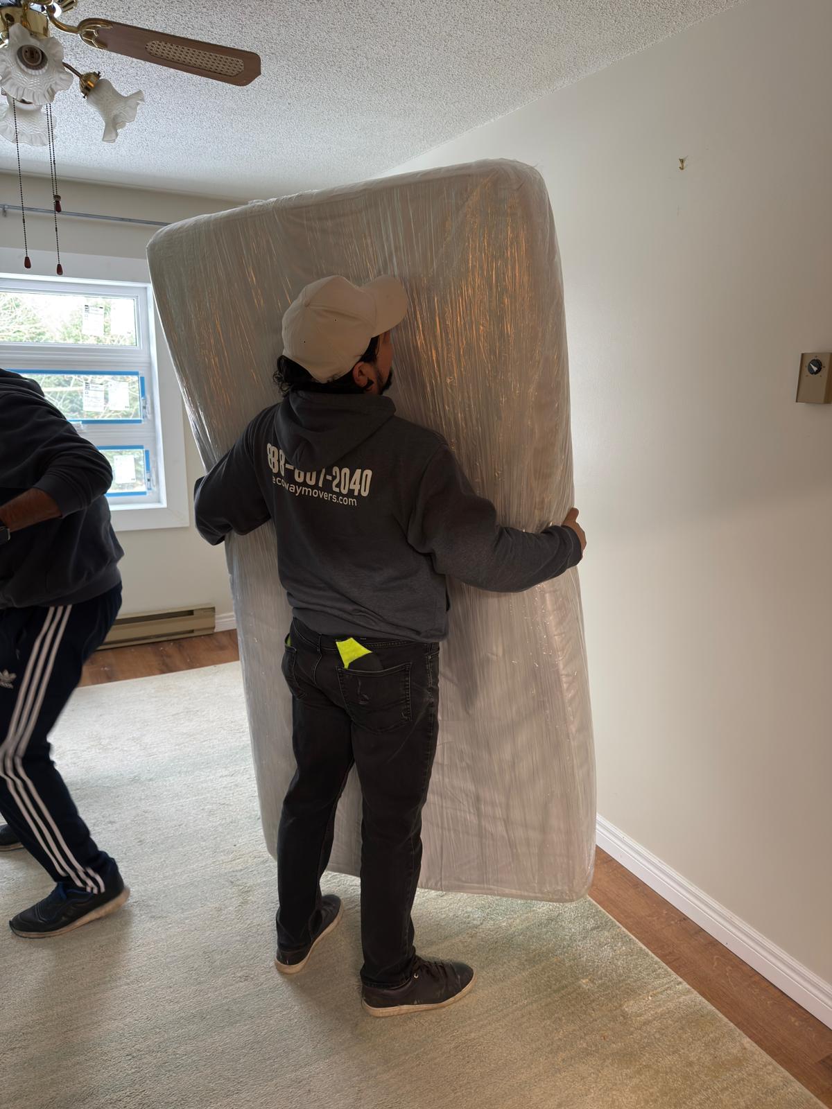 Priority glass crates staged efficiently for transport during a Surrey move.