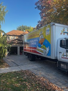 Wrapped display shelf being moved carefully by professional movers in Montreal.