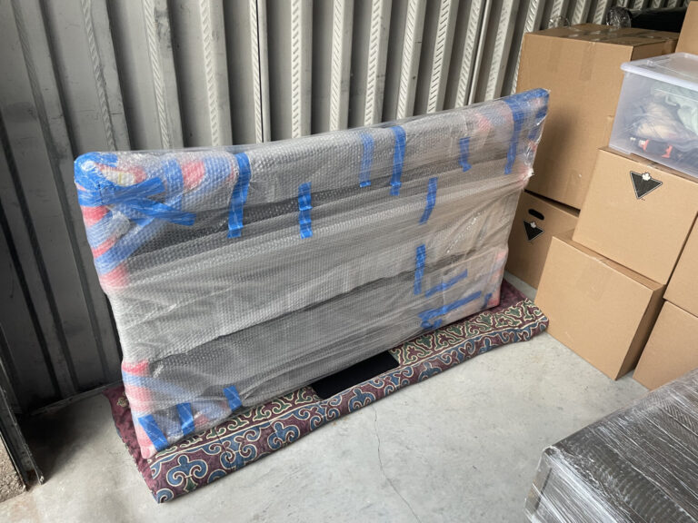 Wooden storage hutch placed inside a Regent Park home after a Toronto move.
