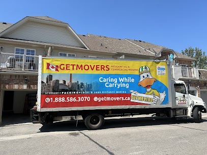 Tall wooden armoire and crystal items prepared for an apartment move in Montreal.