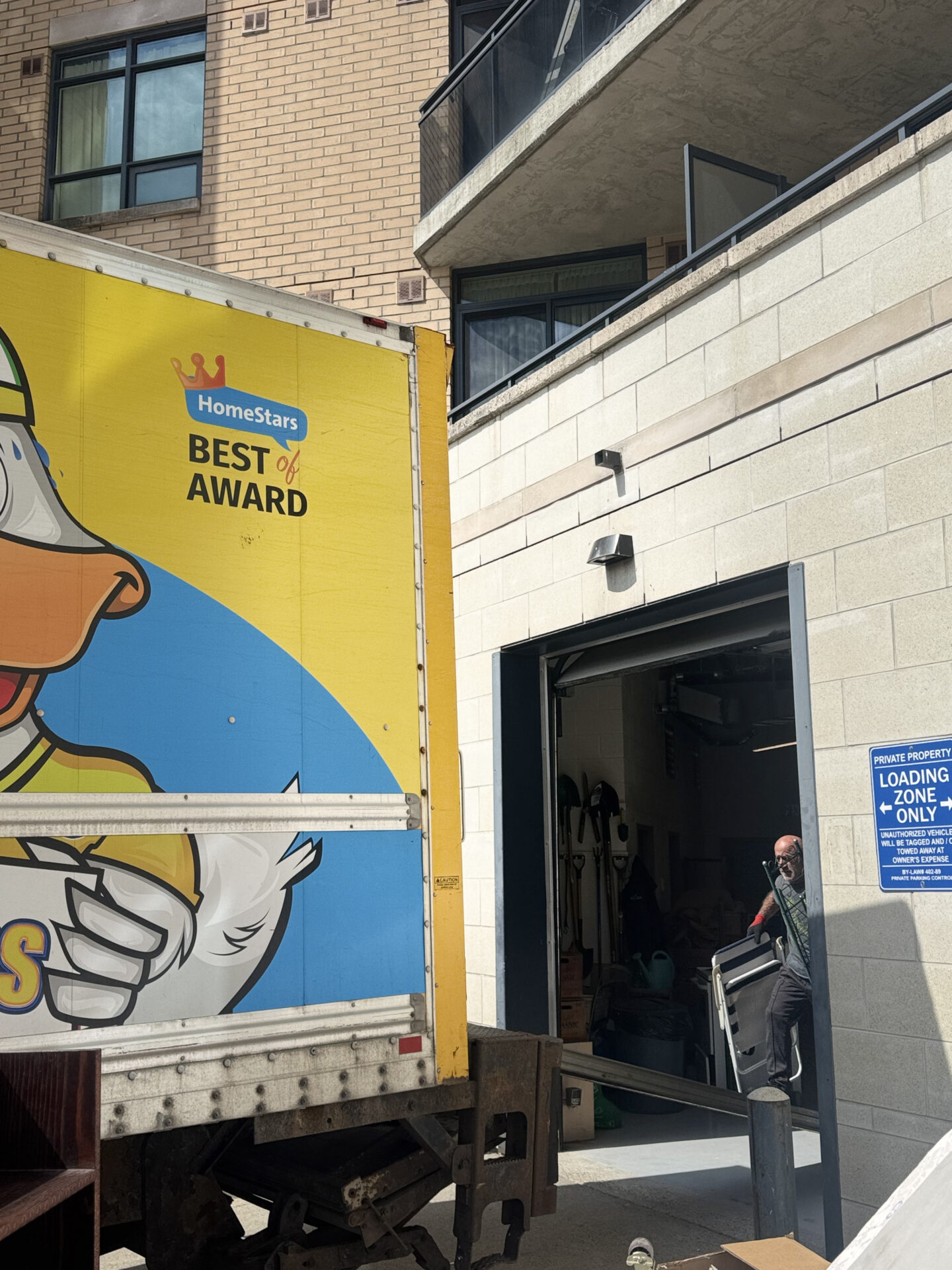 Marble-top table placed inside a Parkdale home after a Toronto move.