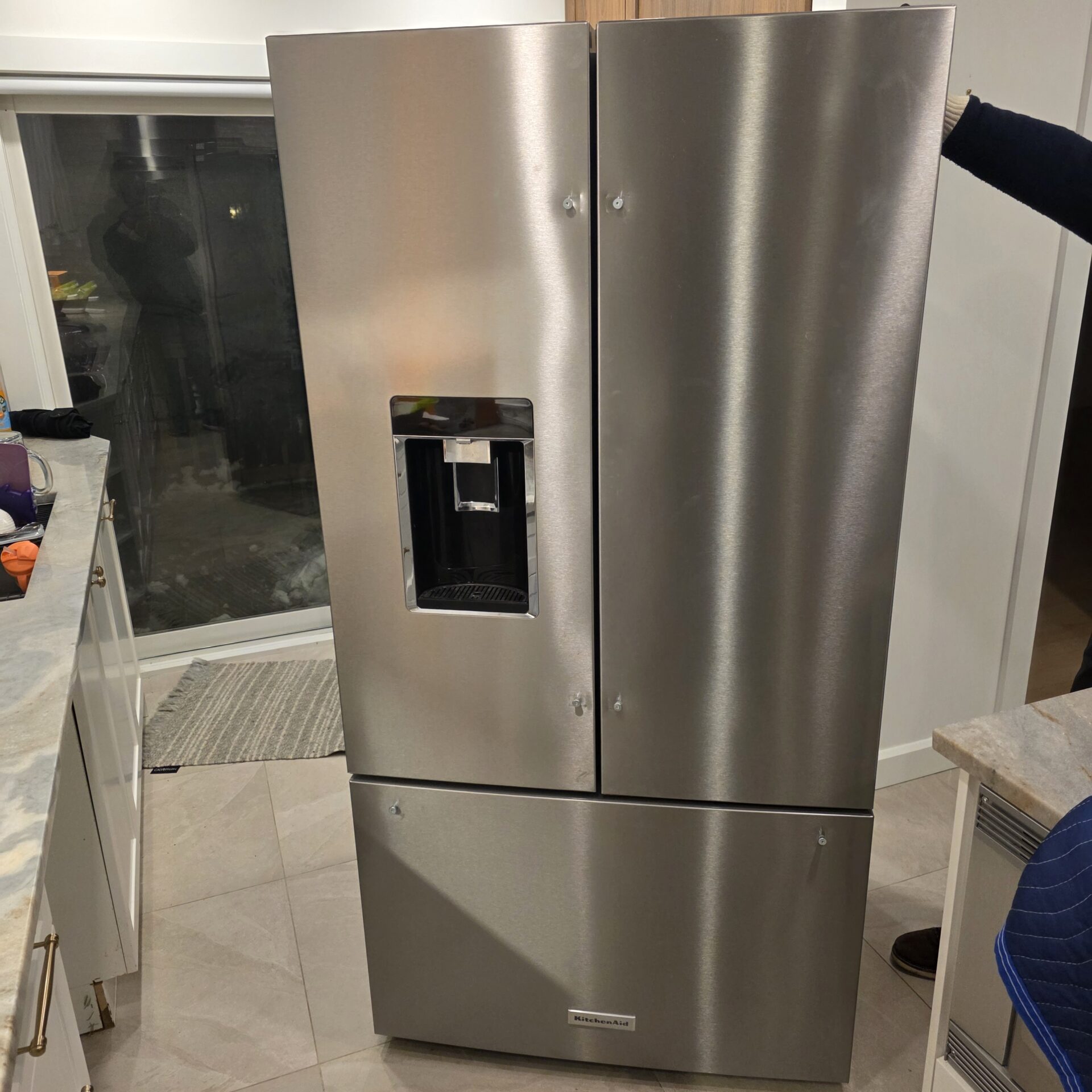 Protective floor runners placed along the exit pathway during an apartment move in Mile-End.