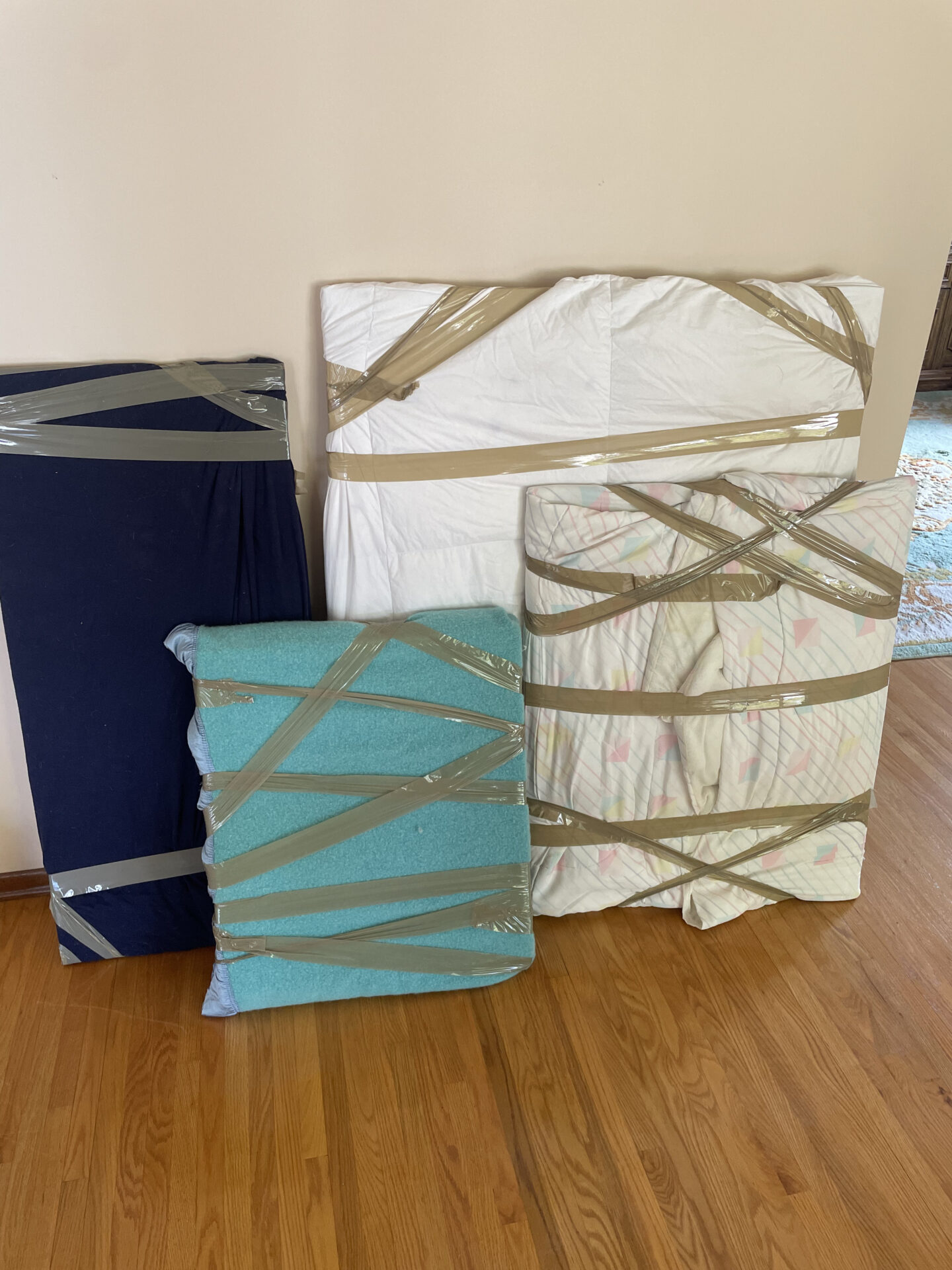 Professional movers maintaining clear pathways during the loading process in an Old Toronto home.