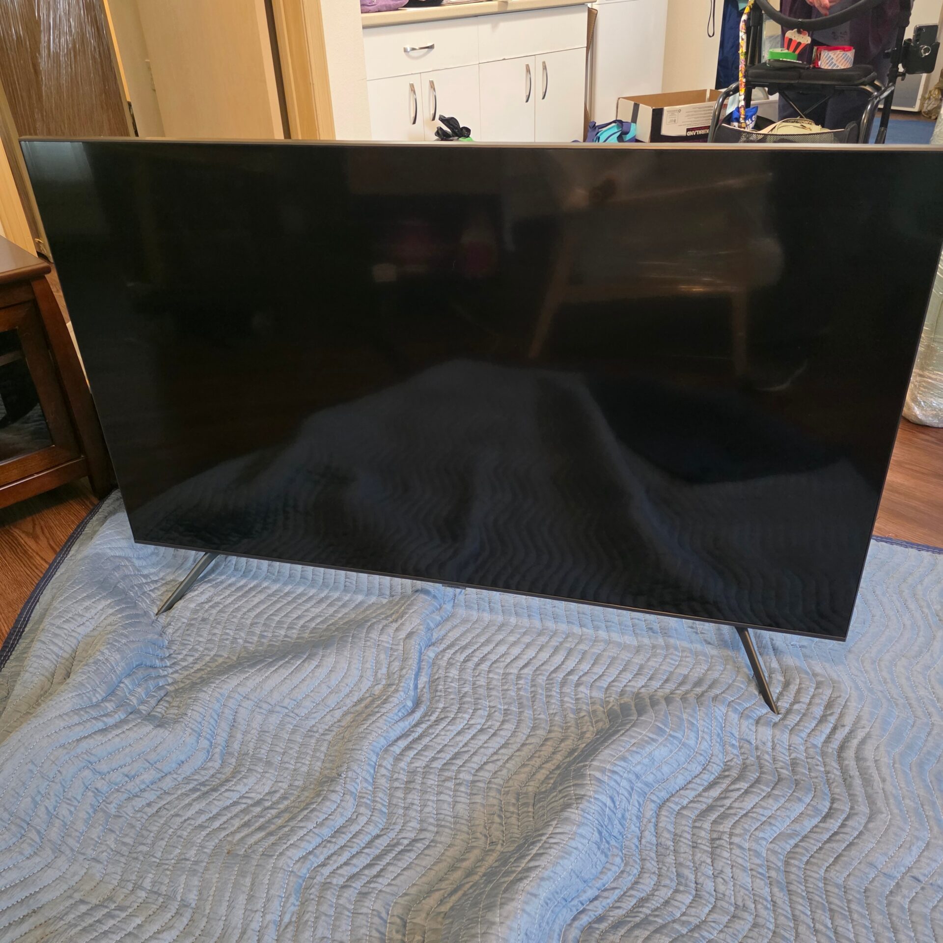 Wooden media console placed inside a Leslieville home after a Toronto move.