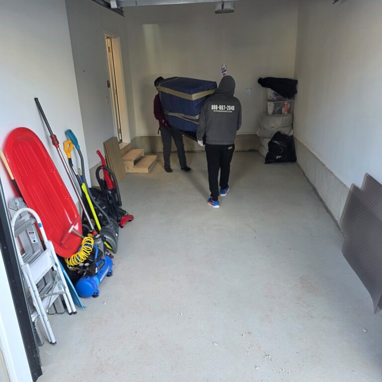 Boxes and furniture loaded carefully for transport into short-term storage.