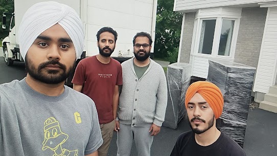 Movers carefully preparing furniture for a home move from Alberta Avenue to Clayton Park West in Edmonton, ensuring safe winter transit.