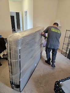 Movers carefully preparing furniture for a home move from Cherry Drive to White Rose Crescent in Aurora, ensuring safe winter transit.
