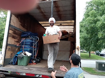 Movers carefully preparing furniture for a home move from Greektown to South Main in Vancouver, ensuring safe transit.