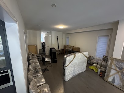 Movers securing a solid-oak china cabinet for a move from Greensborough to Denison in Markham.