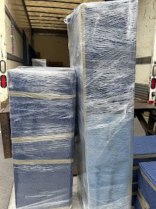 Movers carefully preparing furniture for a home move from Strathcona to South Main in Vancouver, ensuring safe winter transit.