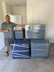 Movers carefully preparing furniture for a home move from Downtown Markham to Headford, ensuring safe winter transit.