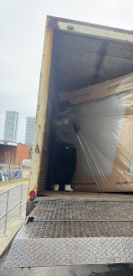 Movers carefully preparing furniture for a home move from Mimico to Lambton in Etobicoke, ensuring safe winter transit.