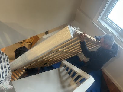 Movers carefully preparing furniture for a home move from York University Heights to Cummer in North York, ensuring safe winter transit.