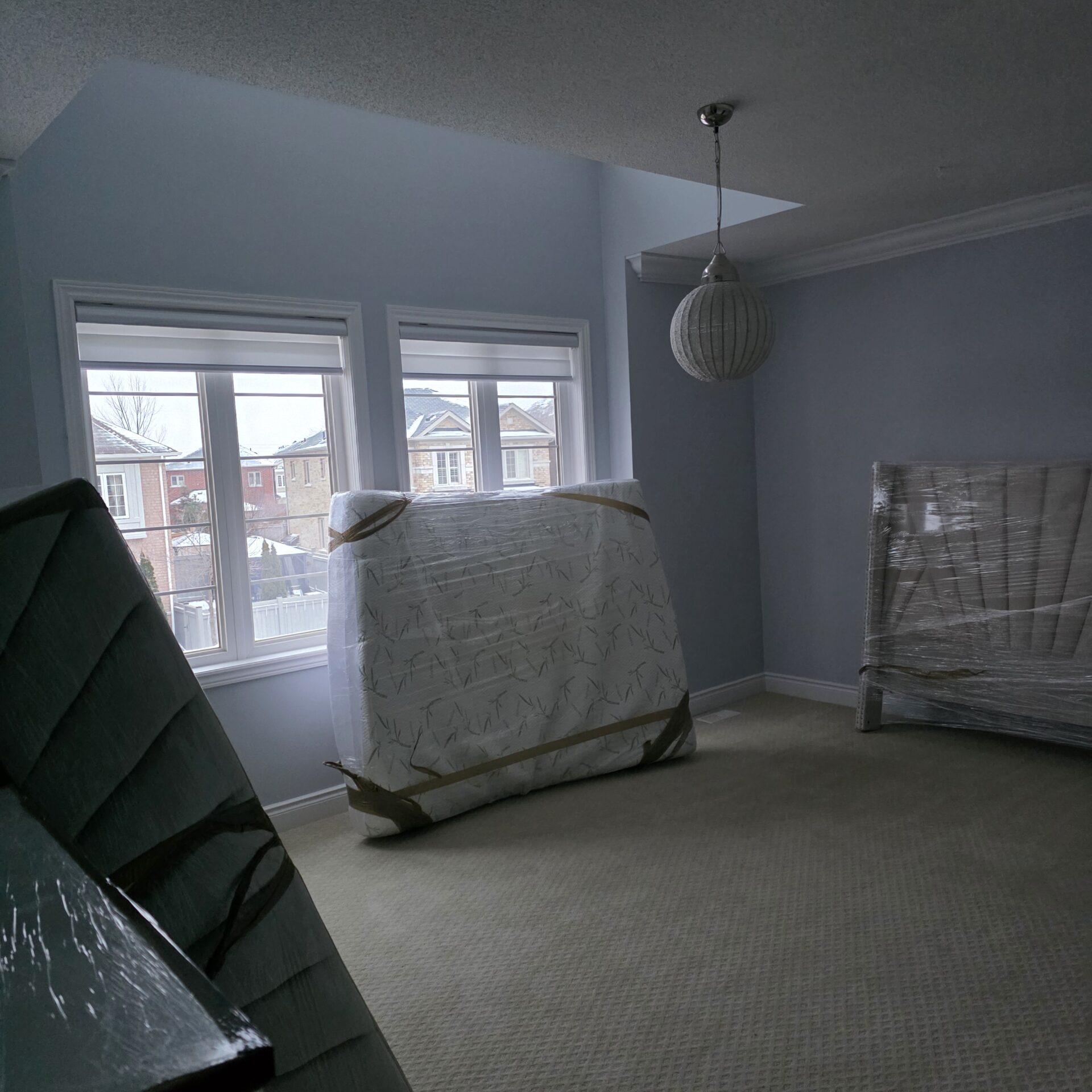 Professional movers maintaining clear pathways during the loading process in a Alta Vista home.