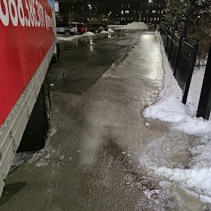Movers carefully preparing furniture for a home move from City Centre to Cooksville in Mississauga, ensuring safe winter transit.