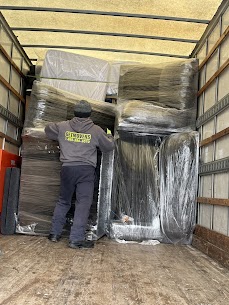 Movers carefully preparing furniture for a home move from Pringle Creek to Whitby Shores in Whitby, ensuring safe winter transit.