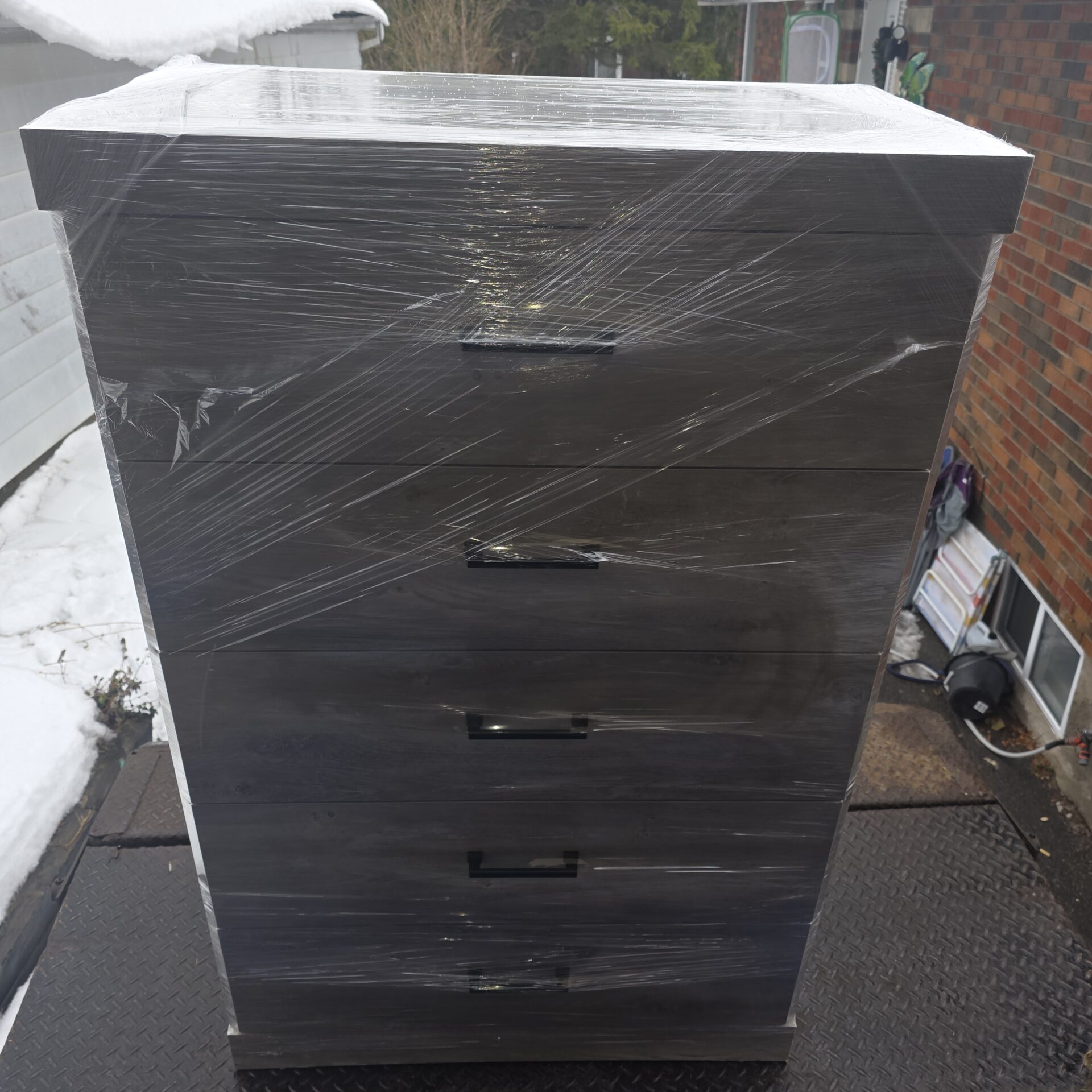 Professional movers transporting a vintage floor lamp safely in Ottawa.