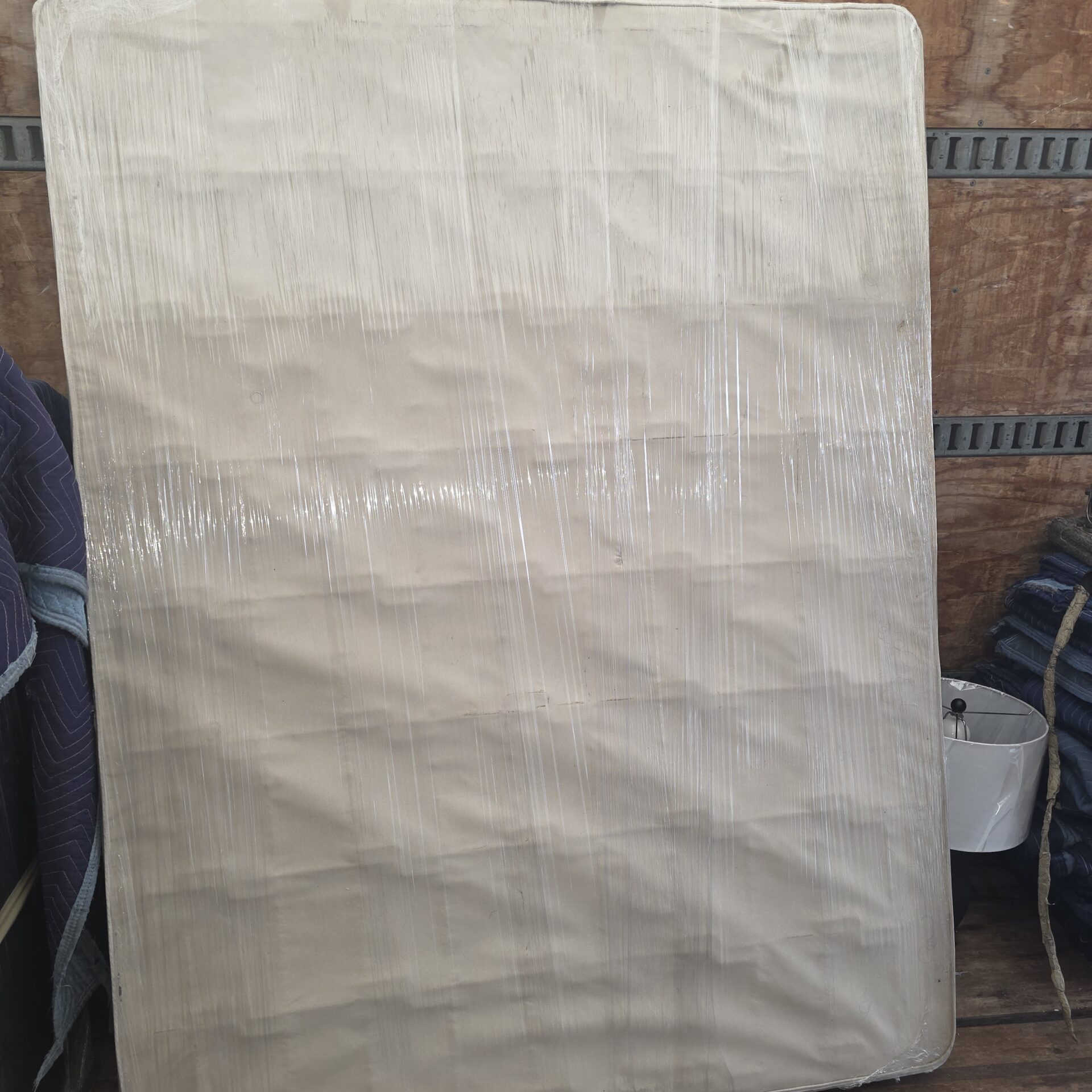 Professional movers maintaining clear pathways during the loading process in a Alta Vista home.