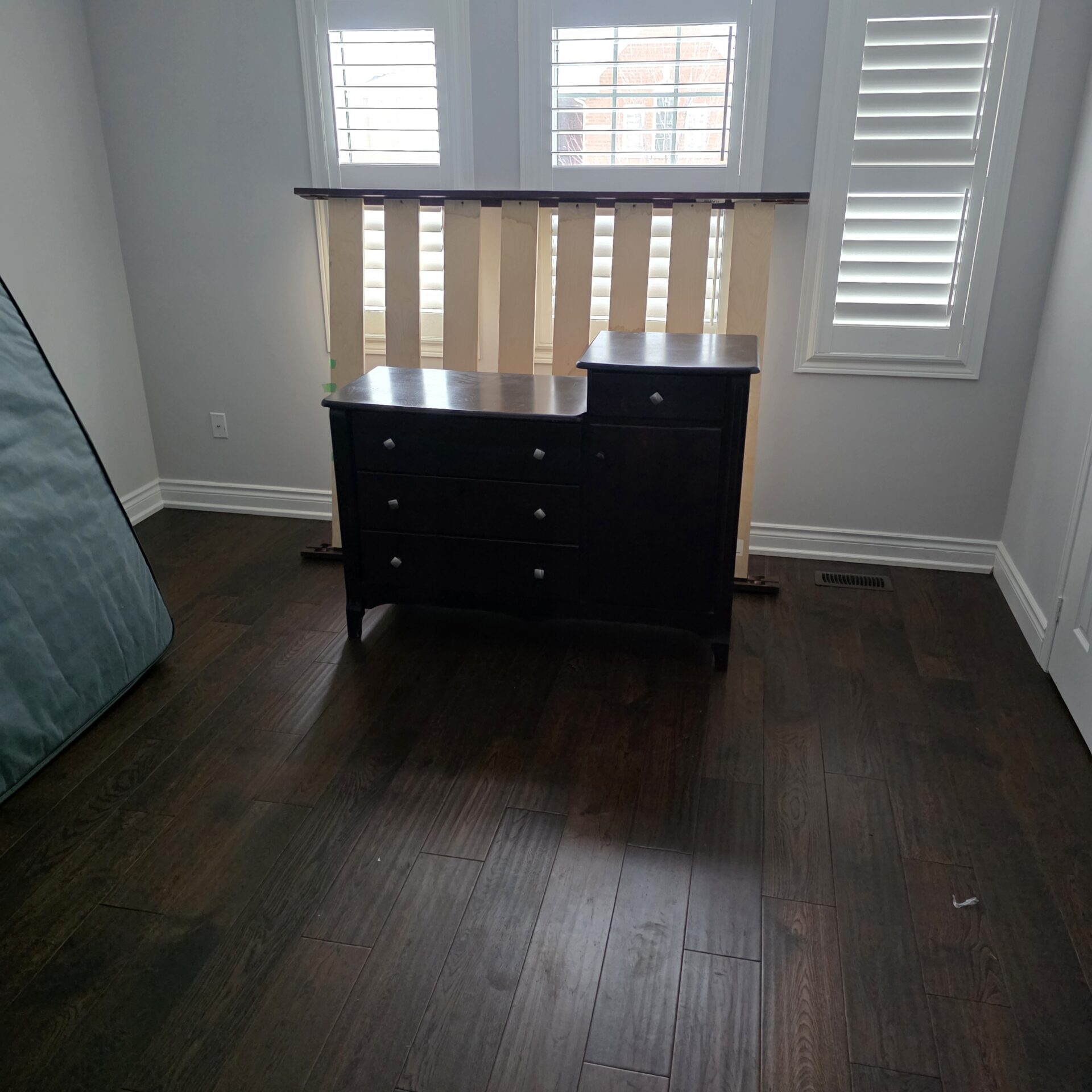 Professional movers maintaining clear pathways during the loading process in a Mimico home.