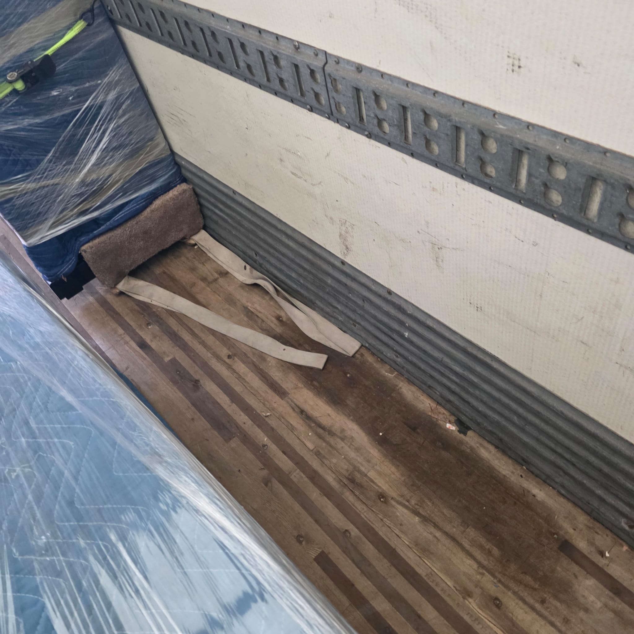 Professional movers maintaining clear pathways during the loading process in a Centretown home.