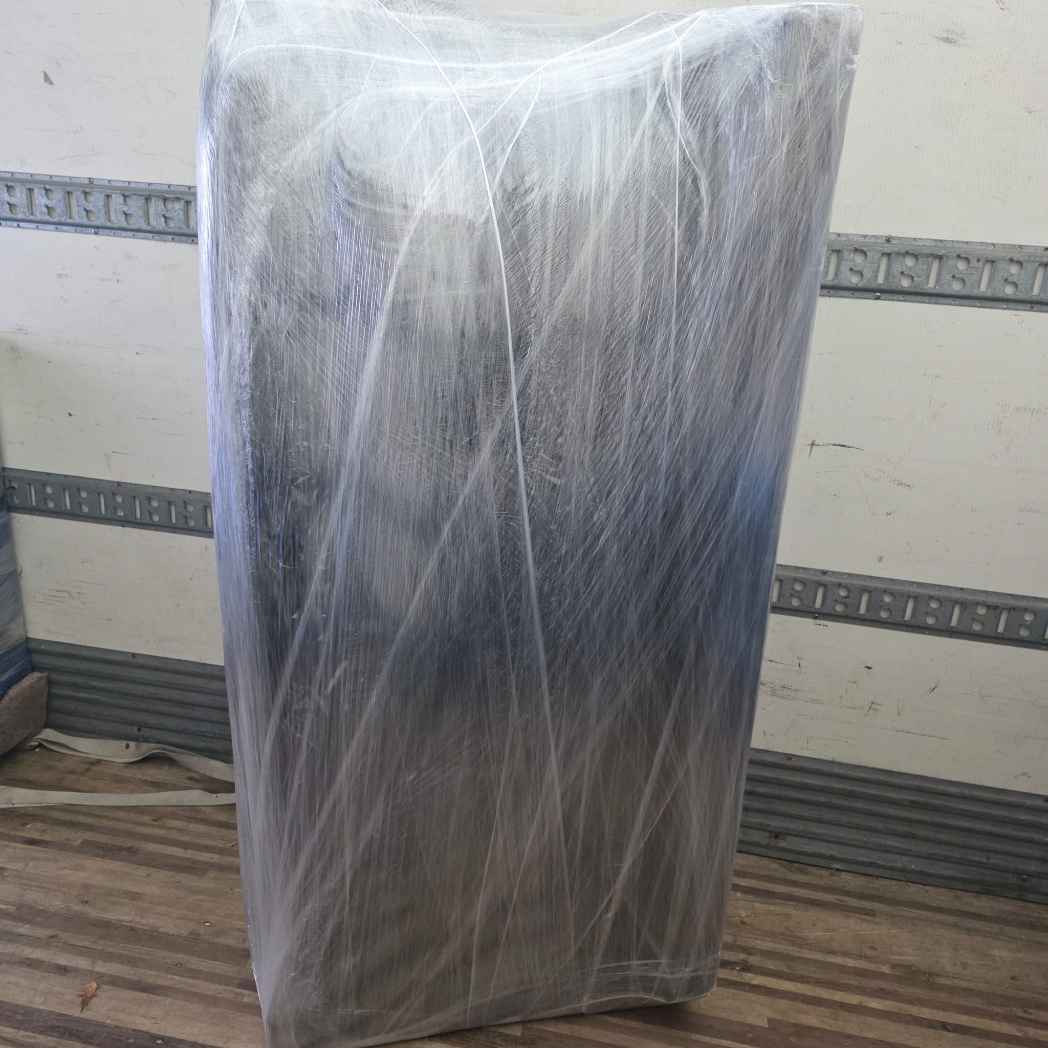 Professional movers maintaining clear pathways during the loading process in a Hintonburg home.