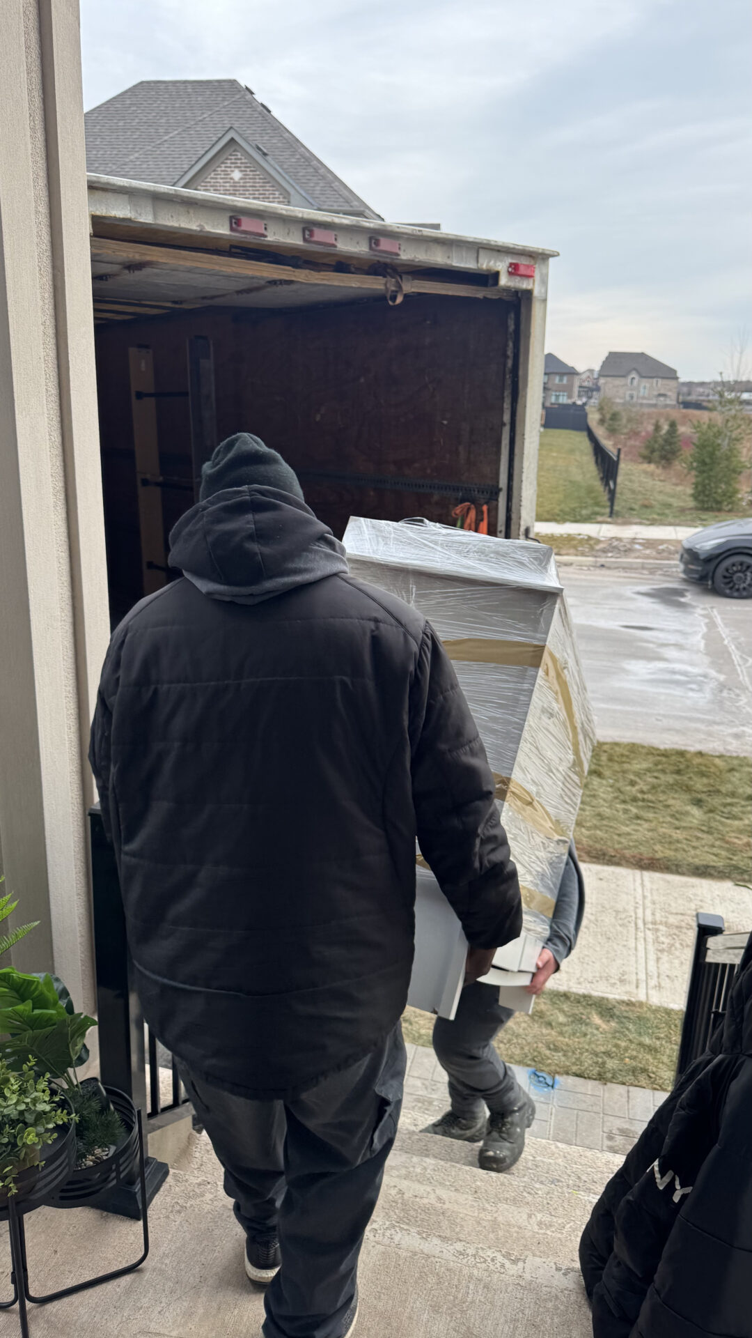 Furniture items wrapped and secured for transport to Sunnylea.