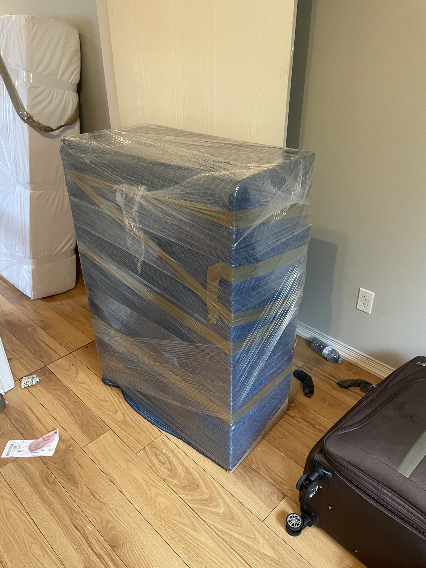 Professional movers maintaining clear pathways during the loading process in a South Cambie home.