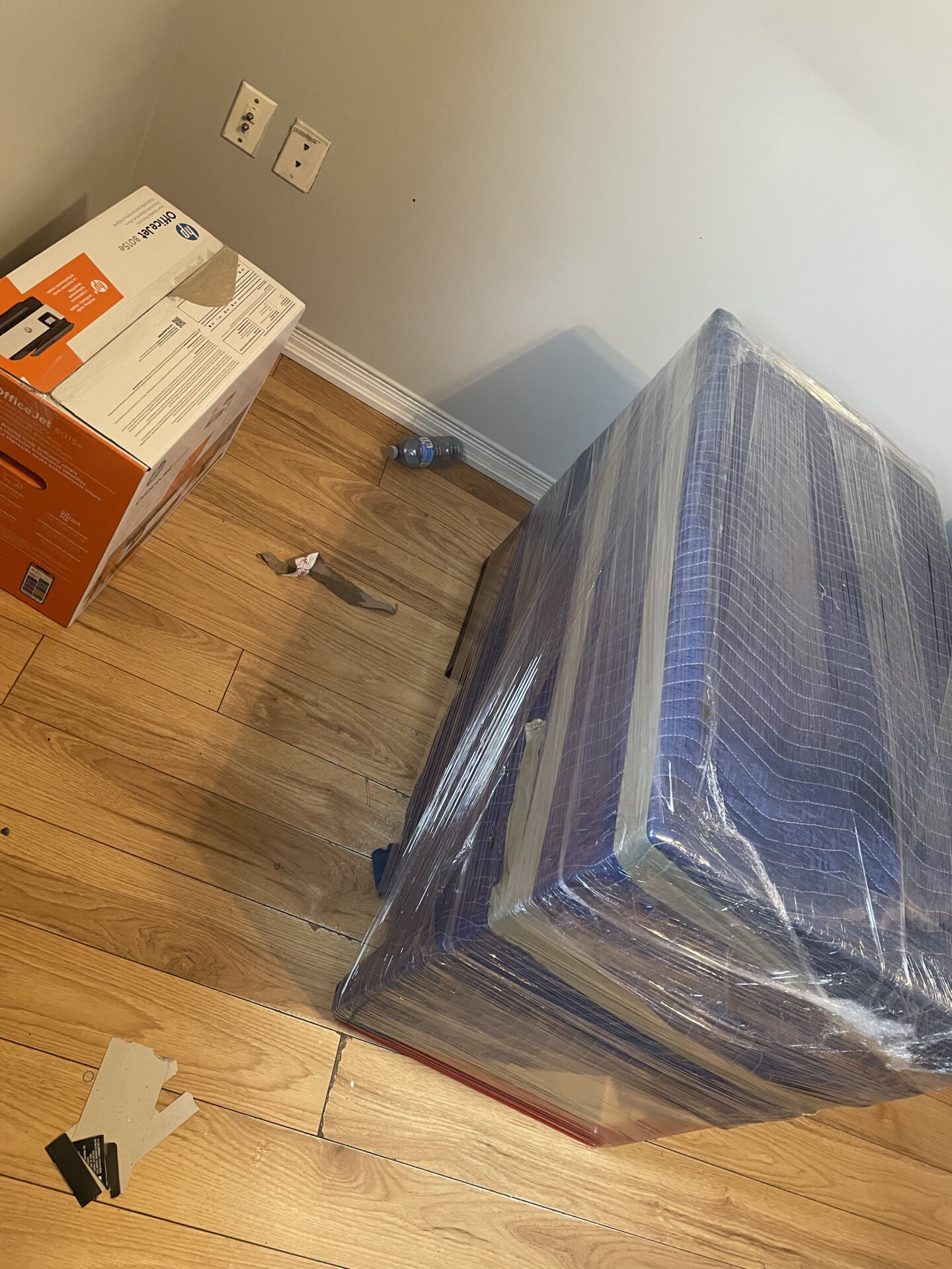 Professional movers maintaining clear pathways during the loading process in a Unionville home.