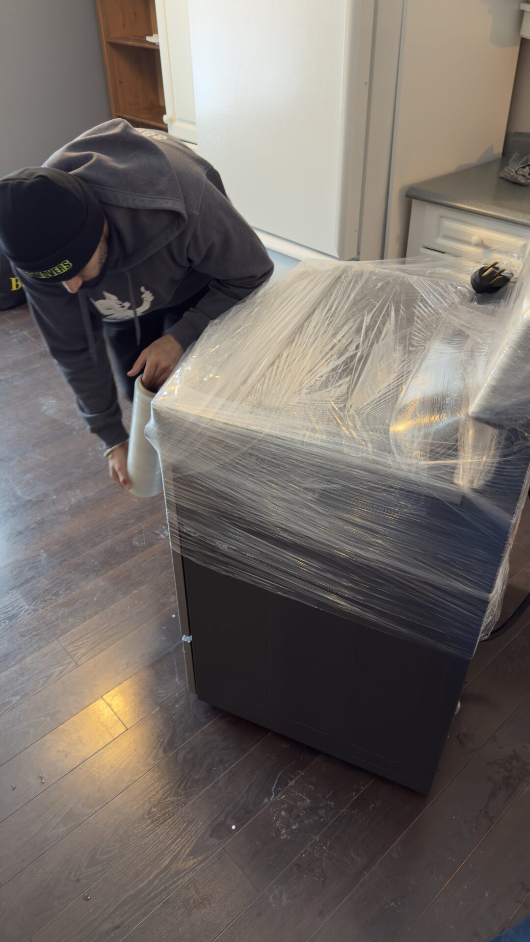 Professional movers maintaining clear pathways during the loading process in a Kirkendall North home.