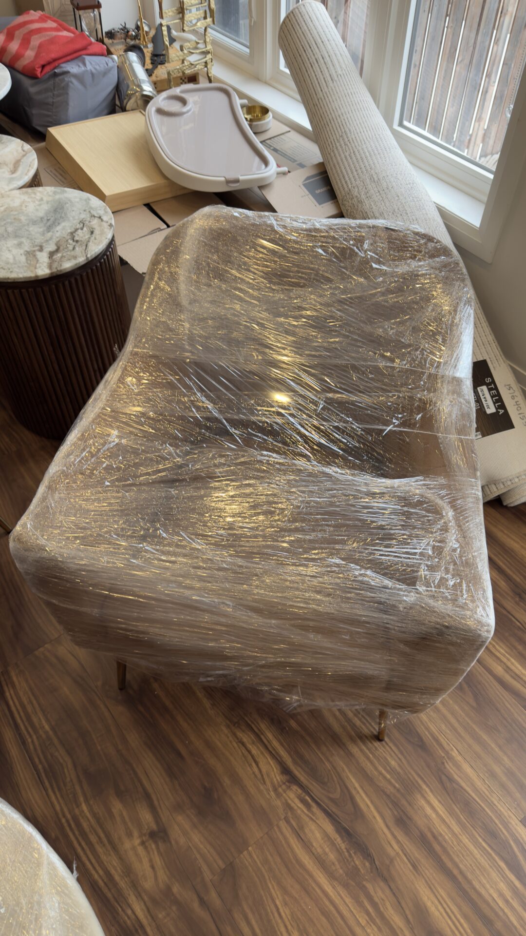 Professional movers maintaining clear pathways during the loading process in a Carlington home.