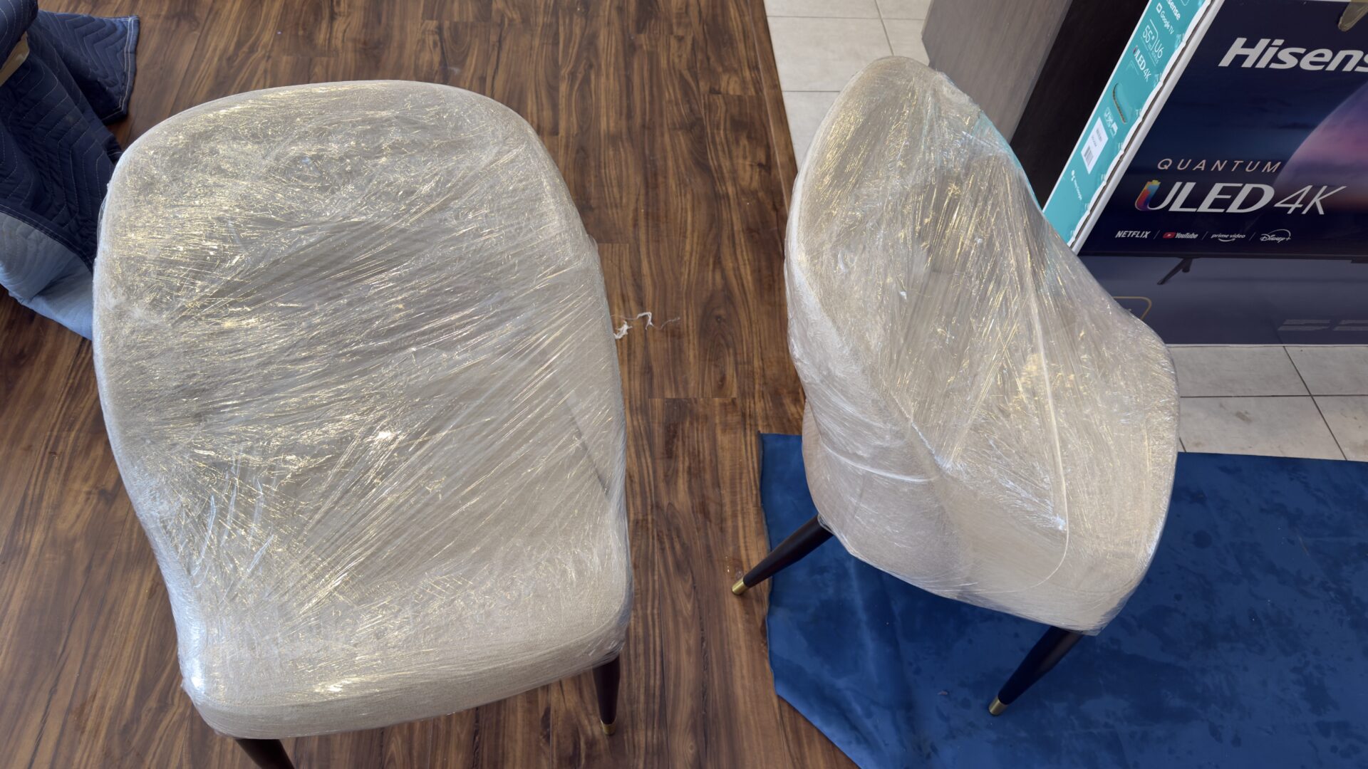 Professional movers maintaining clear pathways during the loading process in a Coal Harbour home.