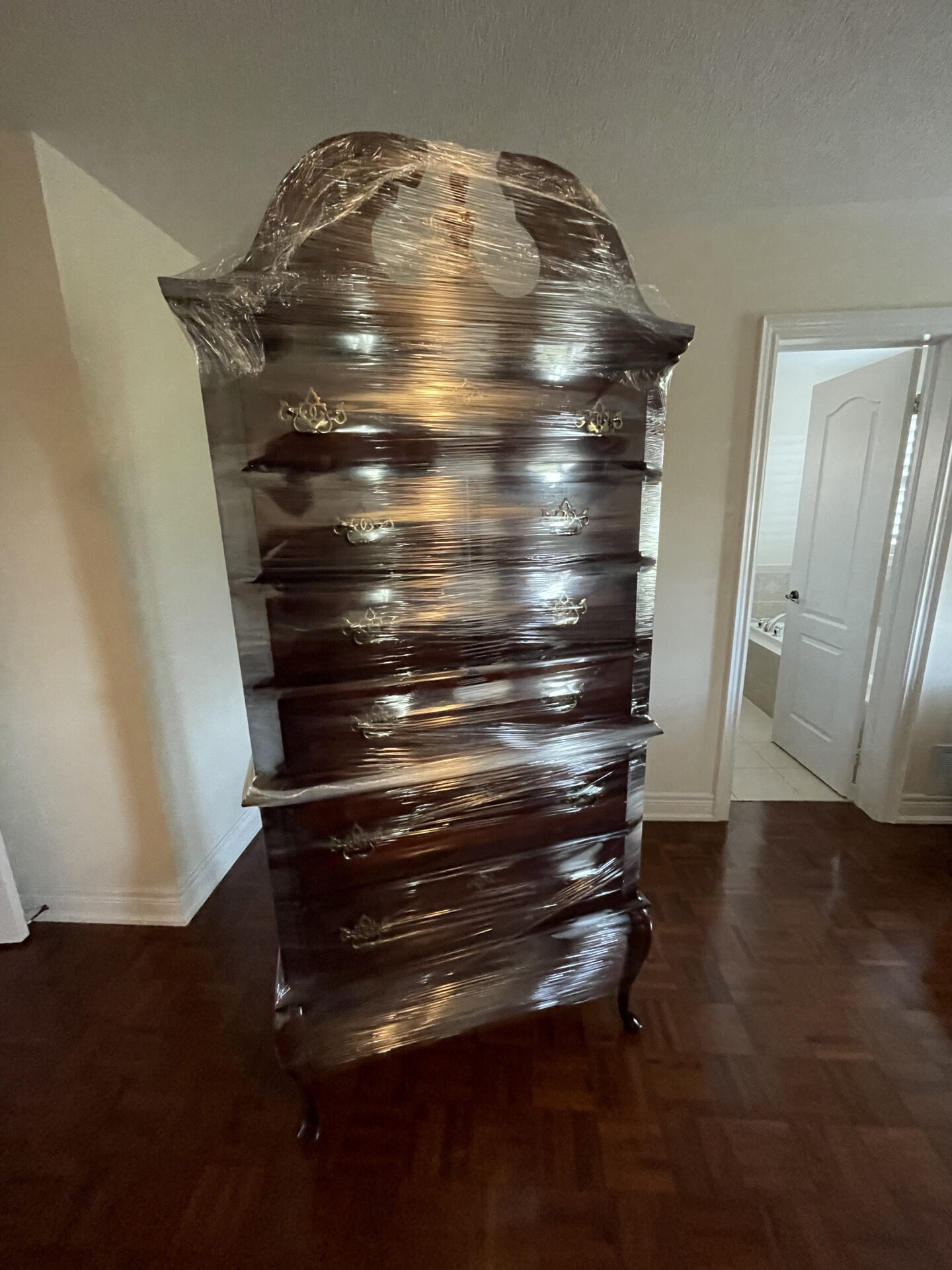 Porcelain bowls packed in crates for transport during a Markham move.