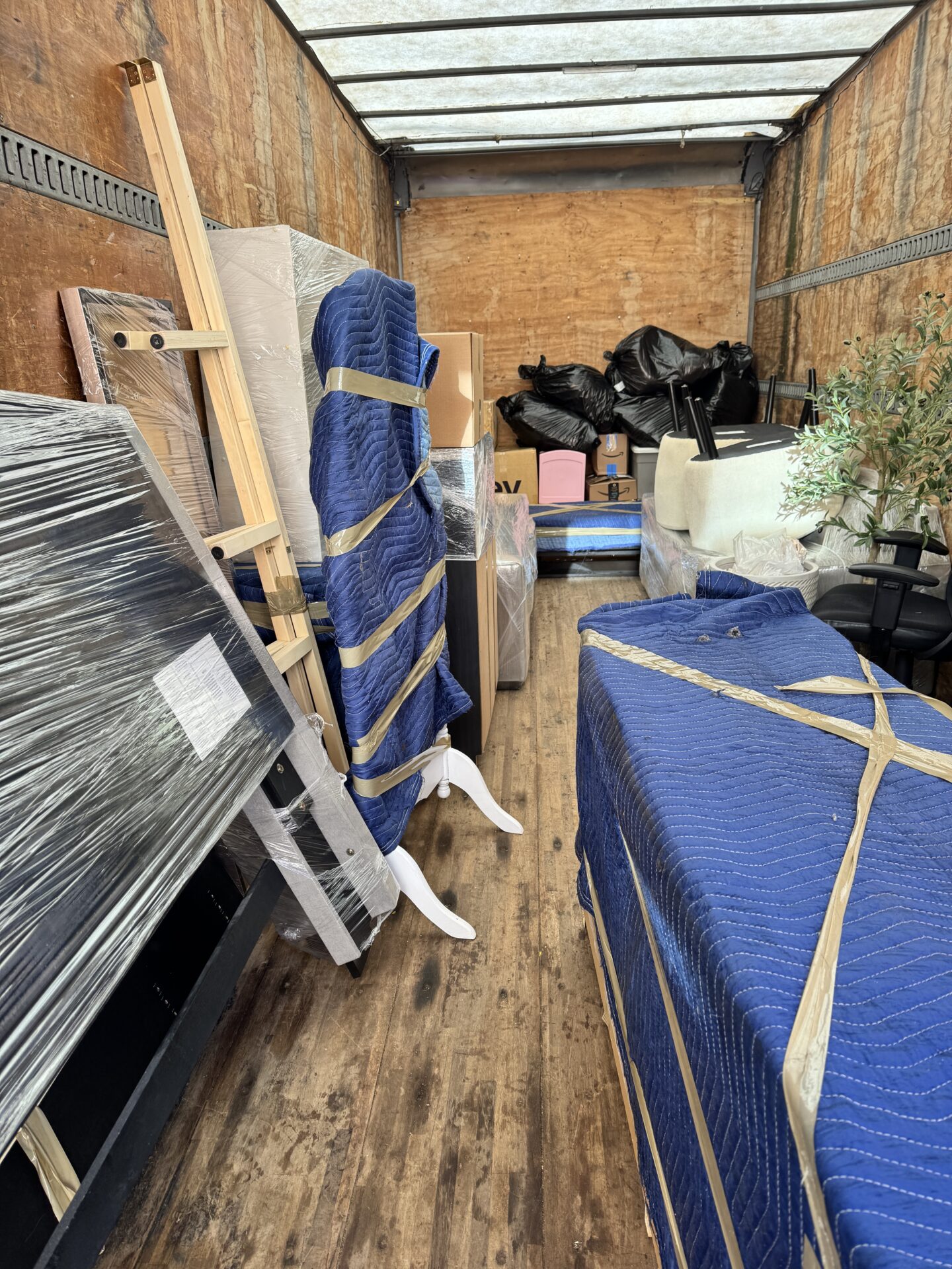 Professional movers maintaining clear pathways during the loading process in a Grant Park home.
