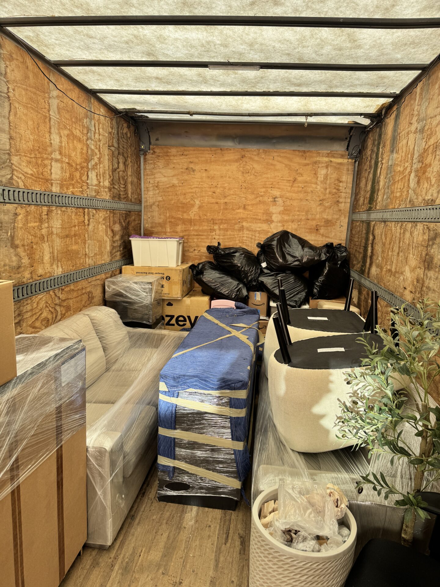 Professional movers maintaining clear pathways during the loading process in a Glenwood home.