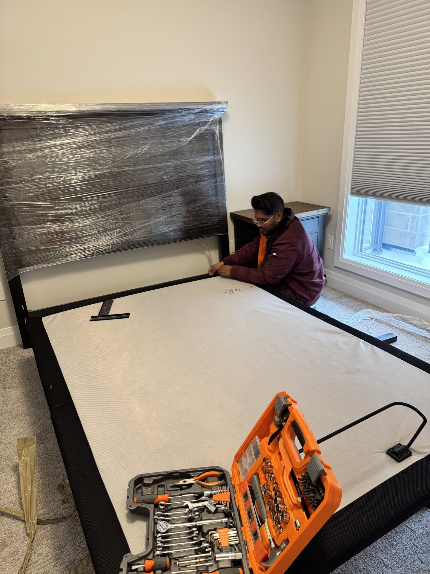 Professional movers maintaining clear pathways during the loading process in a Wolseley home.