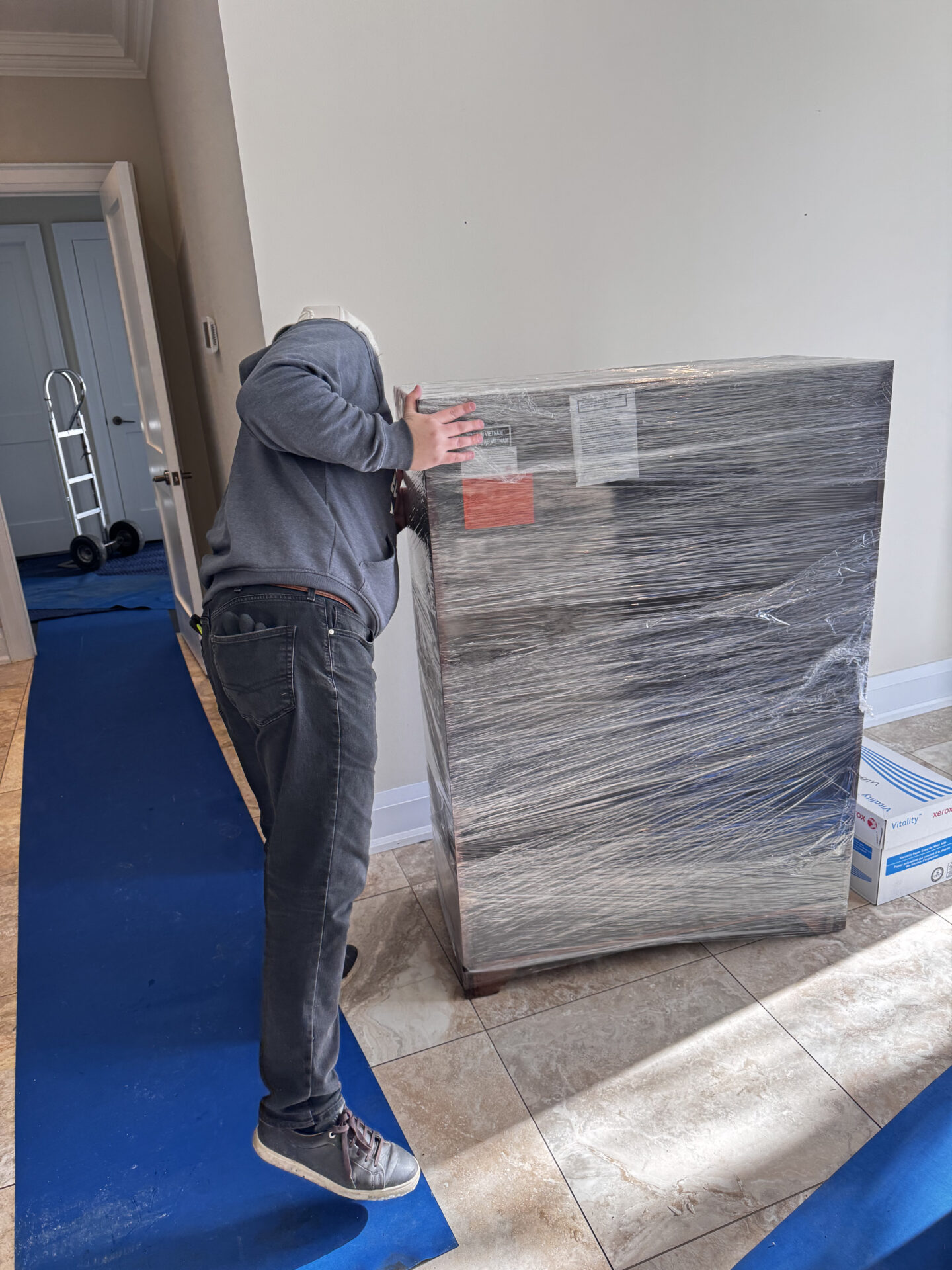 Priority cartons staged efficiently for transport during a Edmonton move.