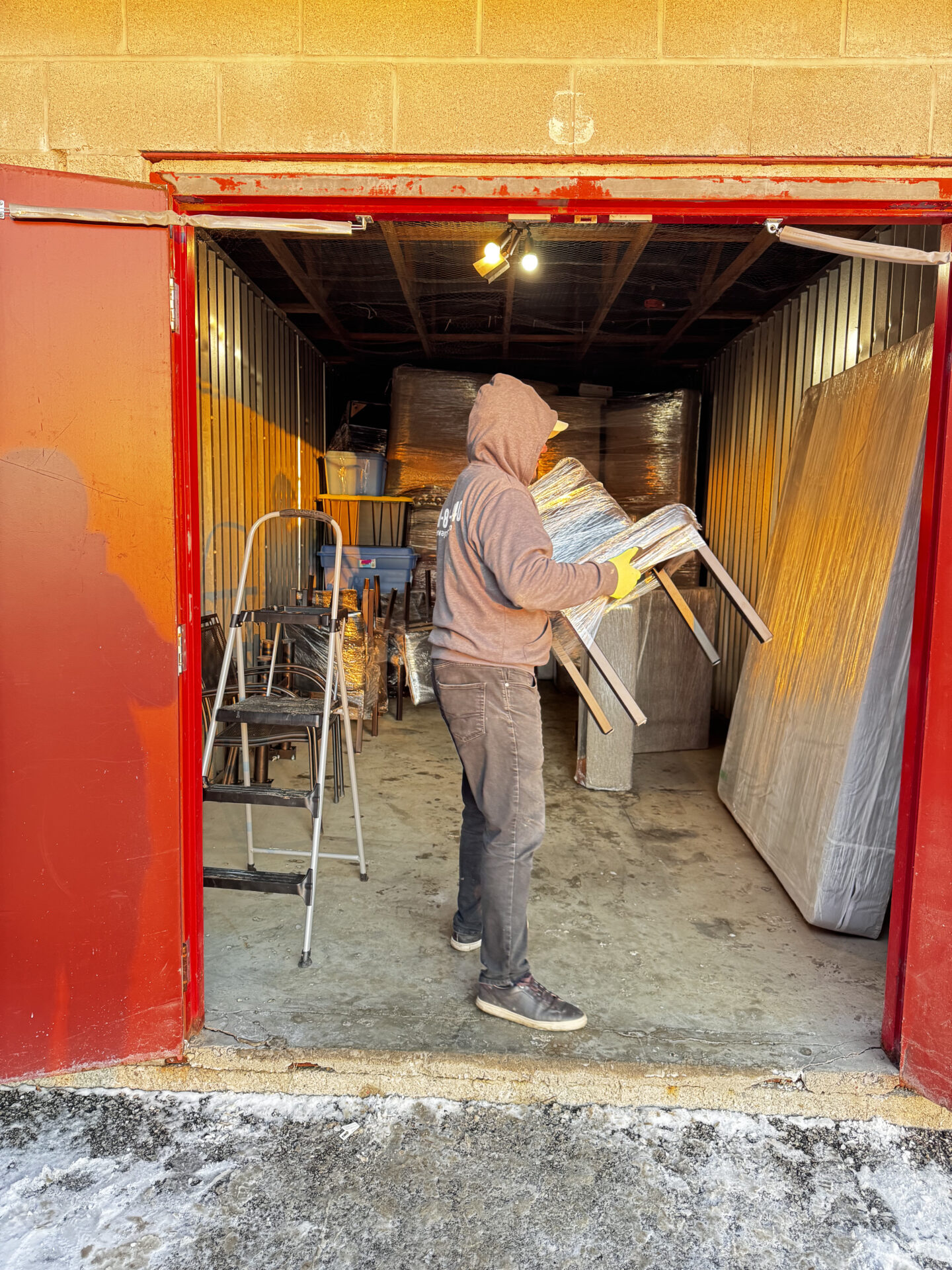 Professional movers maintaining clear pathways during the loading process in a Queen Alexandra home.