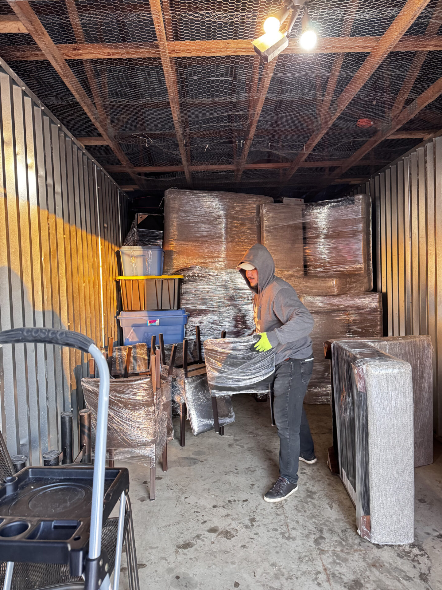 Priority cartons and fitness equipment staged efficiently for transport during an Edmonton move.