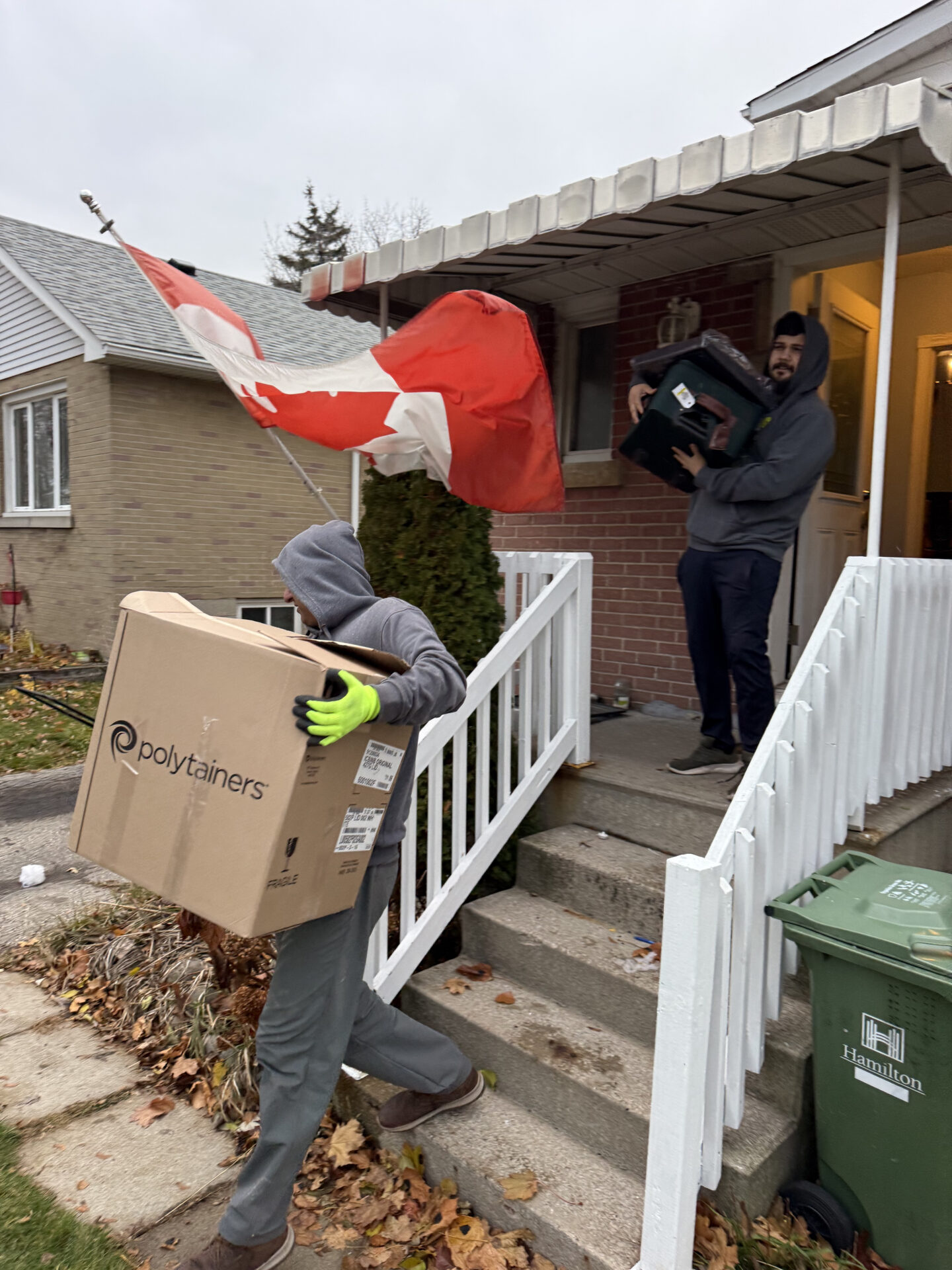 Professional movers maintaining clear pathways during the loading process in a East Village home.