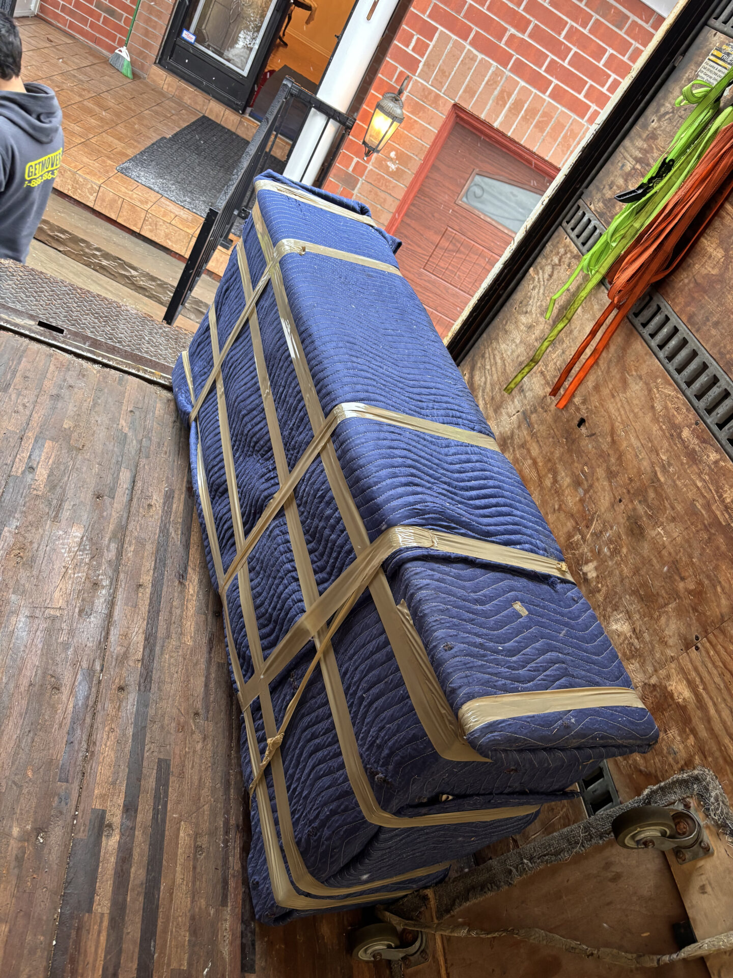 Porcelain plates wrapped in cushioned sleeves inside divider crates.