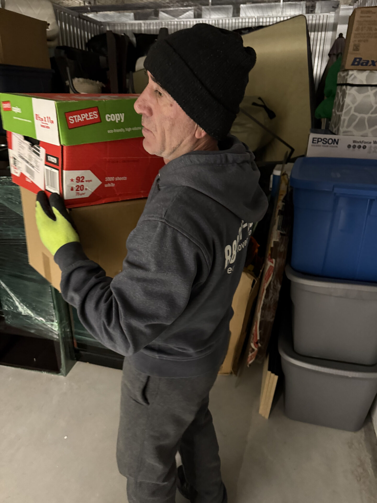 Professional movers maintaining clear pathways during the loading process in a Buttonville home.