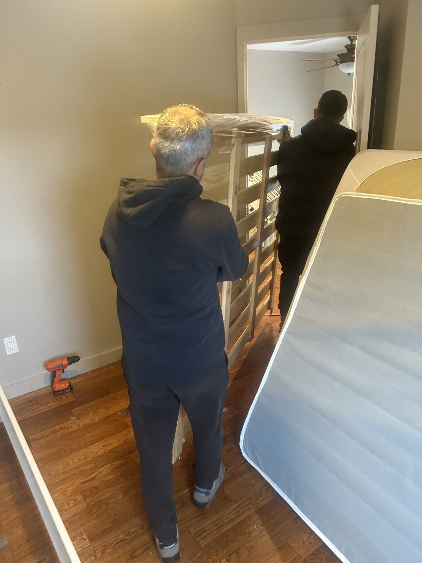 Professional movers maintaining clear pathways during the loading process in a Belvedere home.