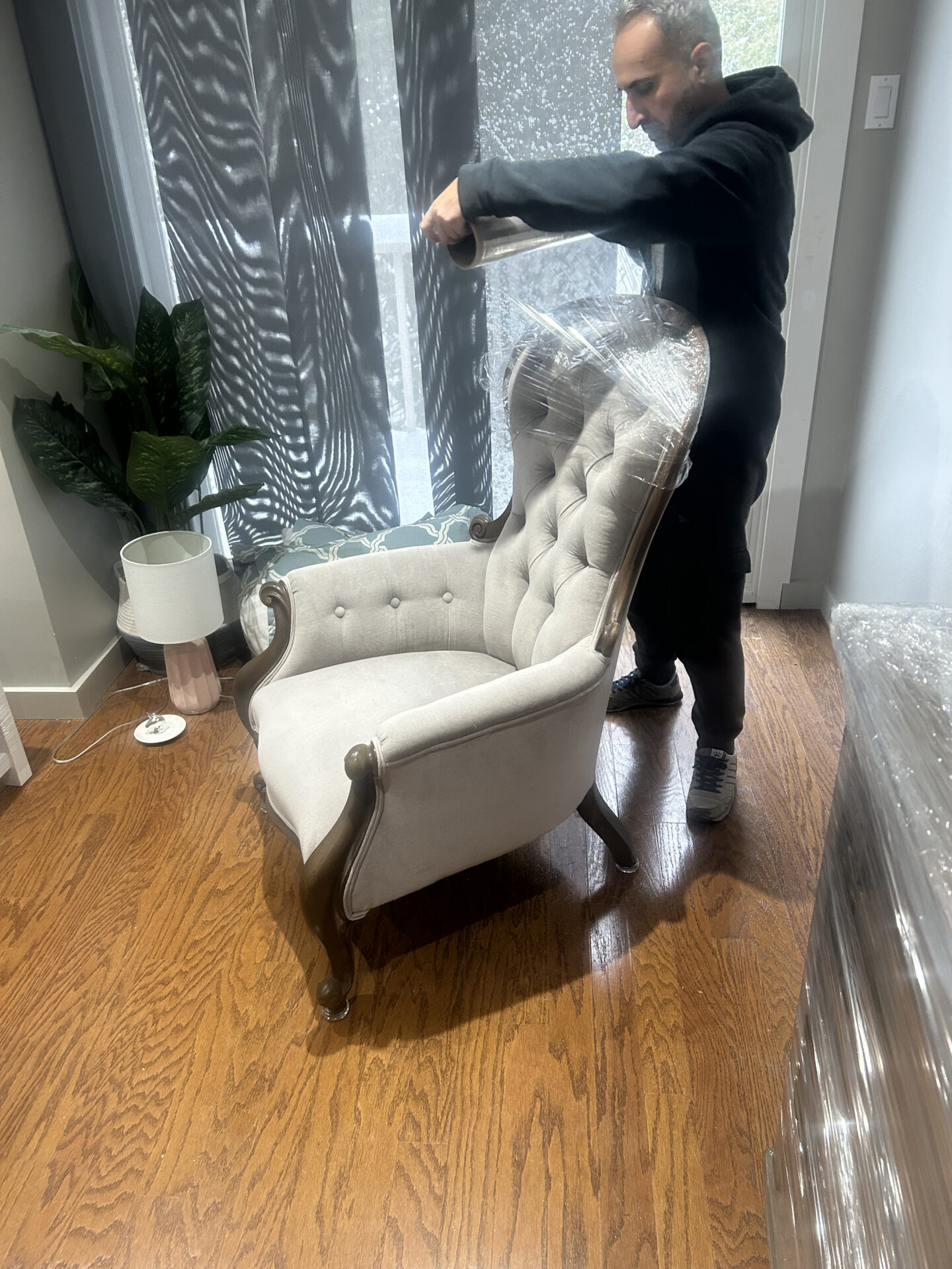 Professional movers maintaining clear pathways during winter loading in Brampton.