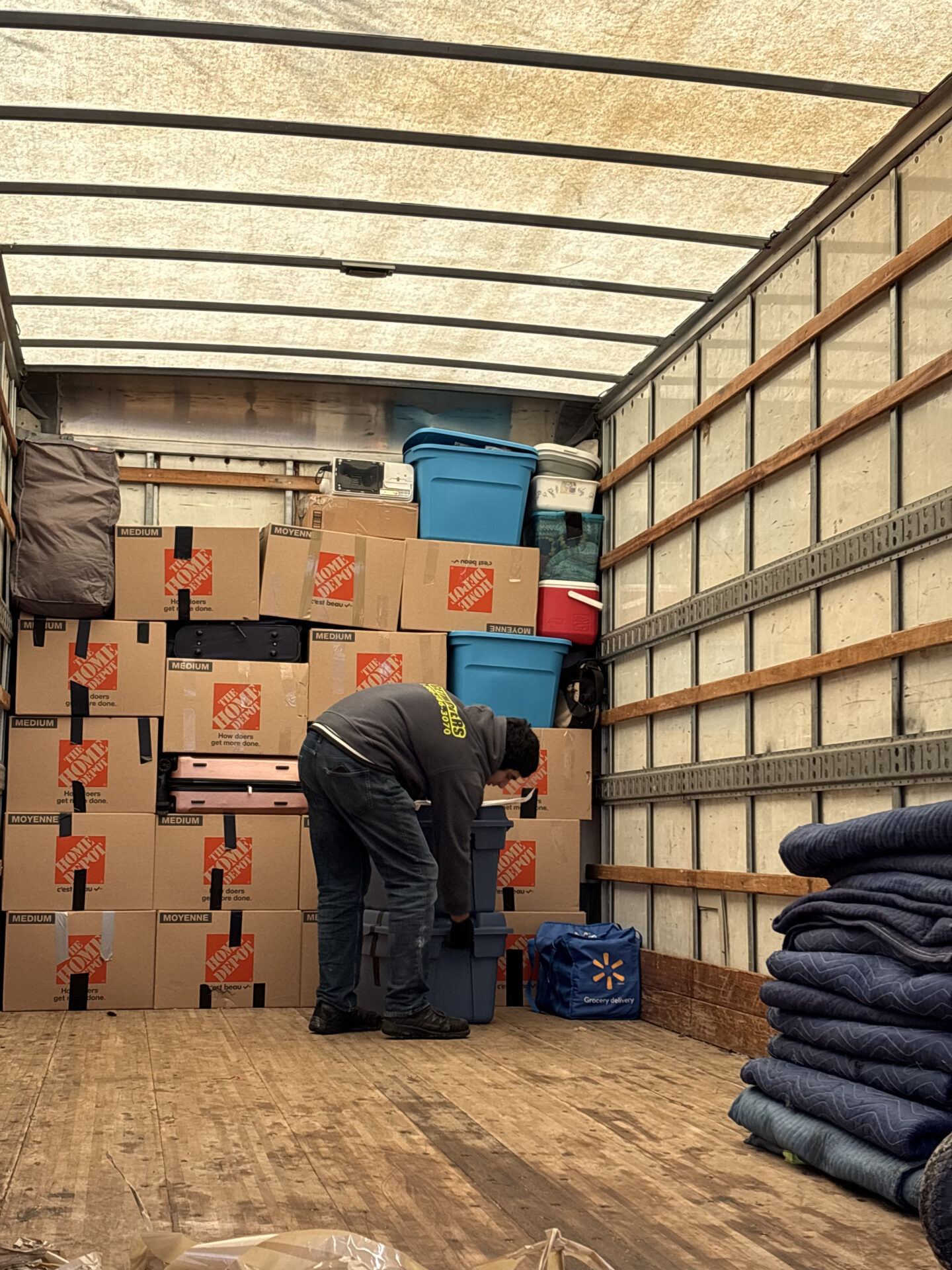 Delicate bowls packed in divider crates for transport during an Edmonton move.